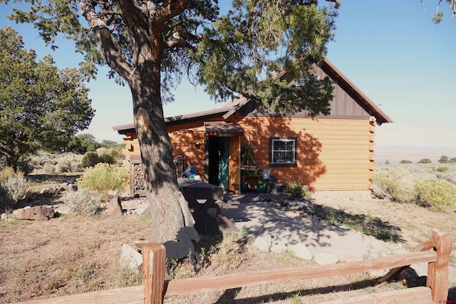 view of log cabin