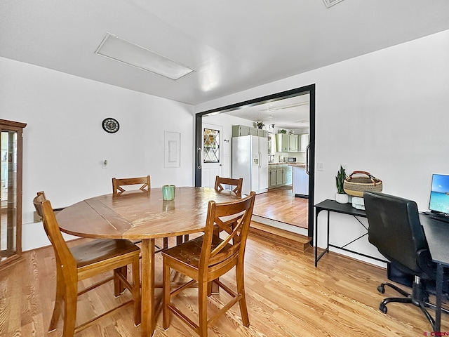 dining space with light wood-type flooring