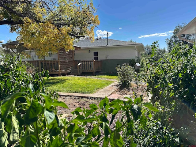 view of yard featuring a wooden deck