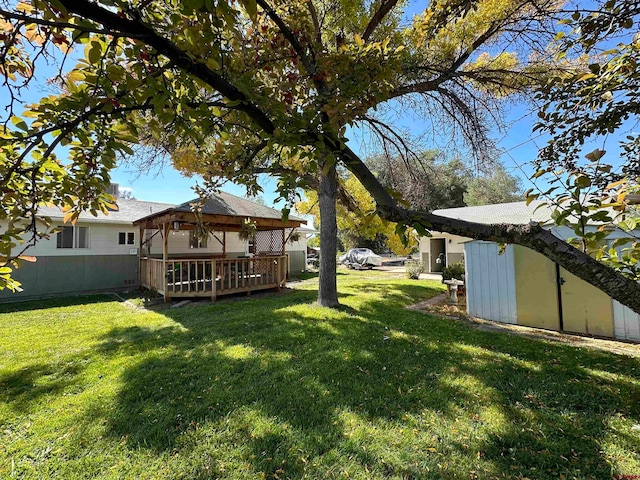 view of yard featuring a gazebo and a deck