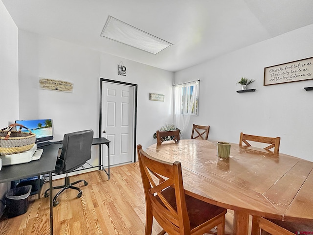 dining space with light wood-type flooring