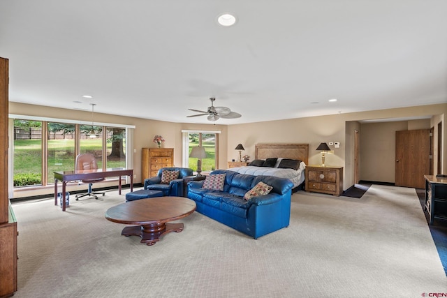 living room with light carpet and ceiling fan