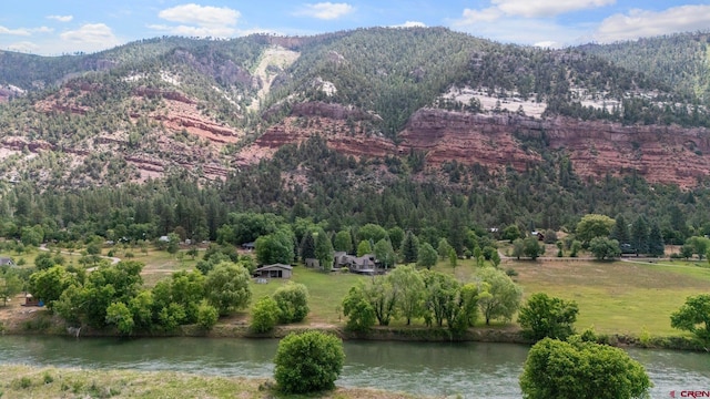 view of mountain feature with a water view