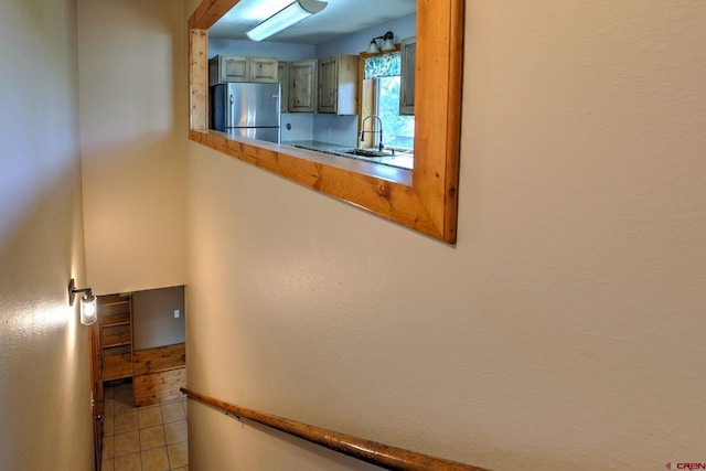 staircase featuring tile patterned flooring