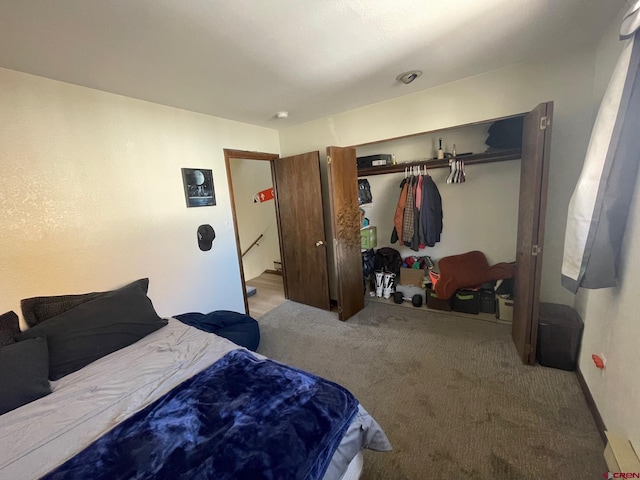 carpeted bedroom with a closet