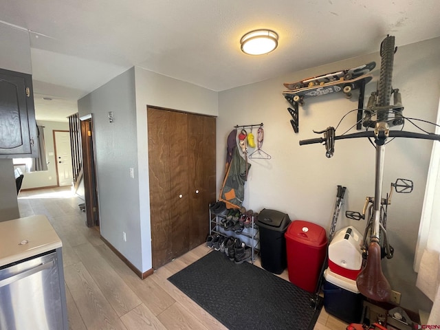 exercise area with light hardwood / wood-style floors