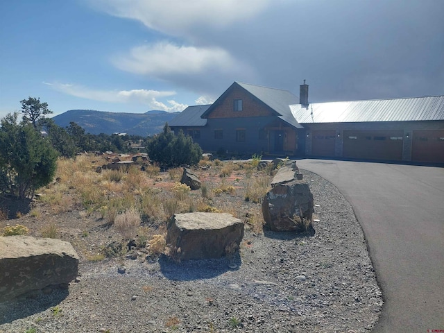 exterior space featuring a mountain view and a garage