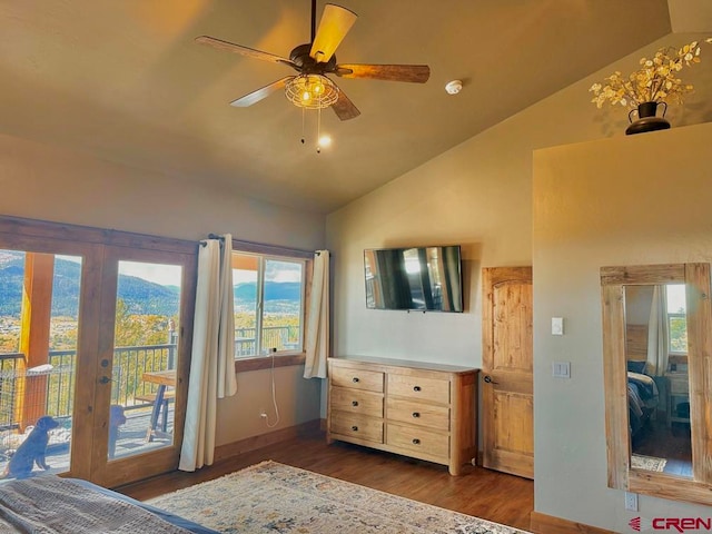 unfurnished bedroom with ceiling fan, french doors, vaulted ceiling, dark wood-type flooring, and access to exterior