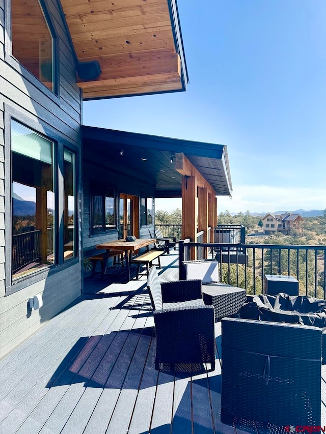 wooden deck featuring an outdoor hangout area