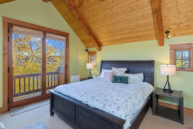 carpeted bedroom with access to exterior, vaulted ceiling with beams, and multiple windows