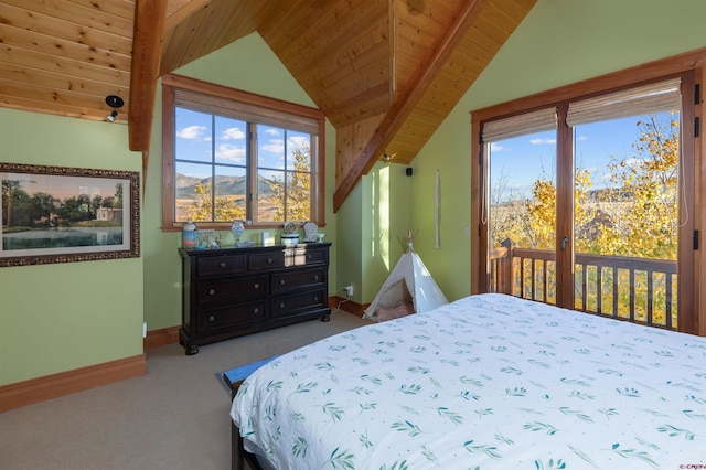 bedroom with a mountain view, access to exterior, light carpet, wood ceiling, and vaulted ceiling with beams