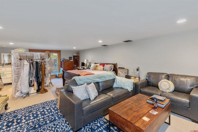 bedroom featuring light colored carpet