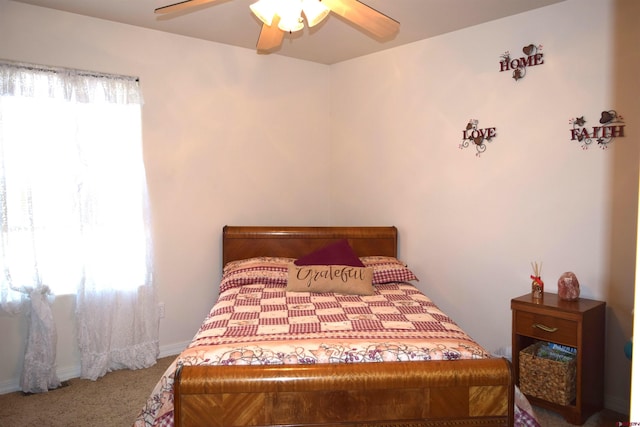 bedroom with carpet, multiple windows, and ceiling fan