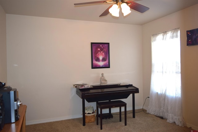 misc room with light carpet, a wealth of natural light, and ceiling fan