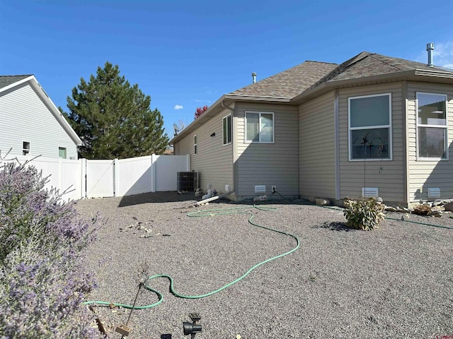 back of property featuring central AC unit