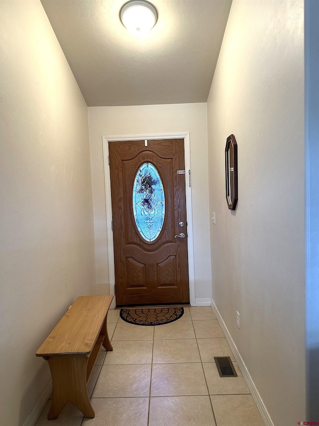 view of tiled foyer entrance