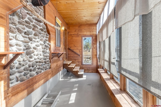 unfurnished sunroom featuring wooden ceiling