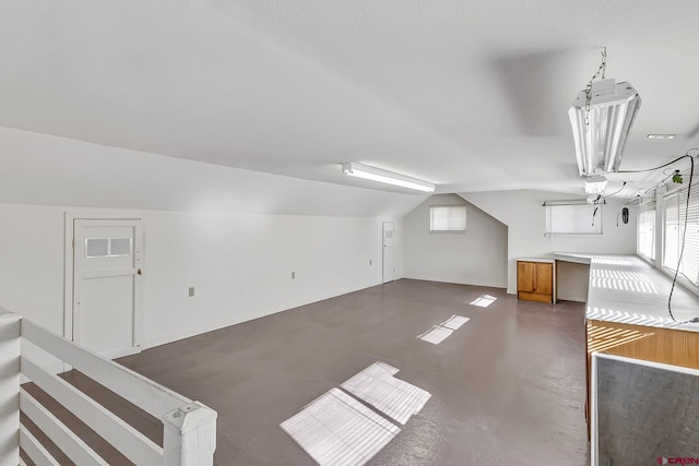 bonus room with vaulted ceiling