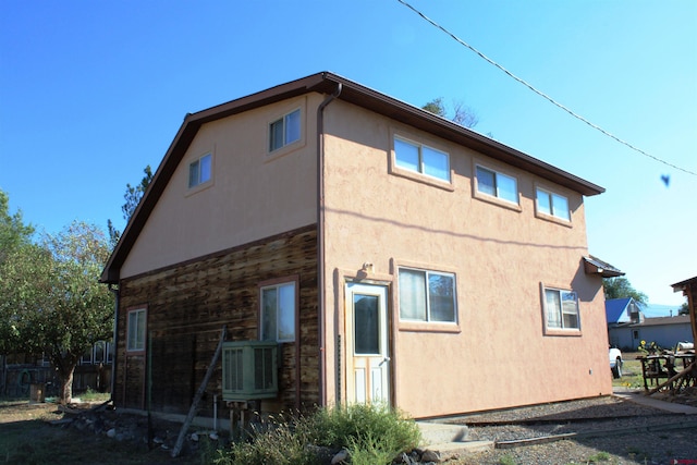 back of property with central AC unit