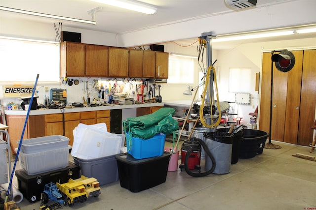 garage featuring a workshop area and a garage door opener