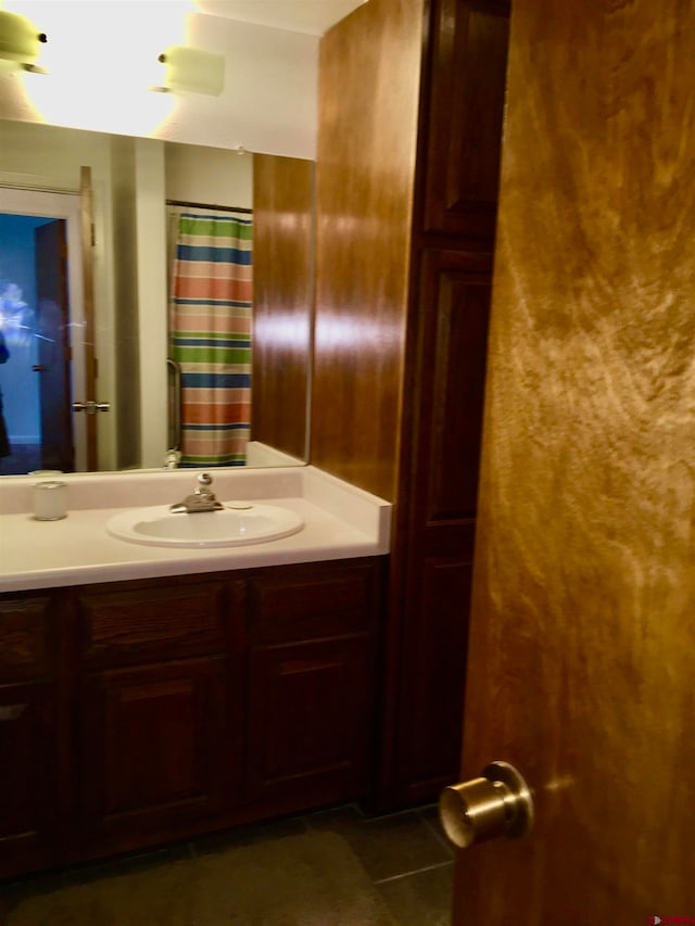 bathroom with tile patterned flooring and vanity