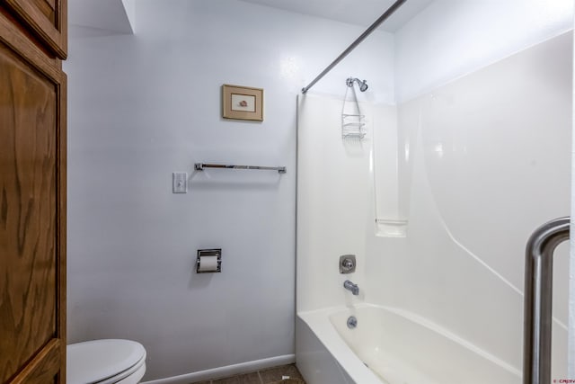 bathroom with tile patterned floors,  shower combination, and toilet