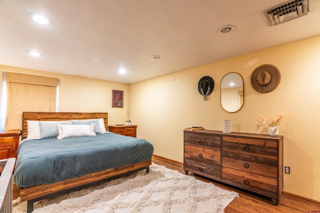 bedroom featuring wood-type flooring