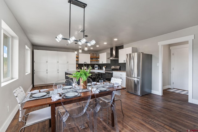 dining space featuring dark hardwood / wood-style flooring