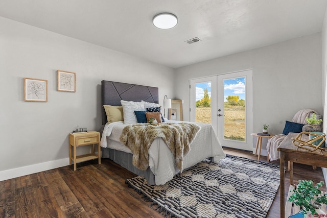 bedroom featuring dark wood-type flooring, access to outside, and french doors