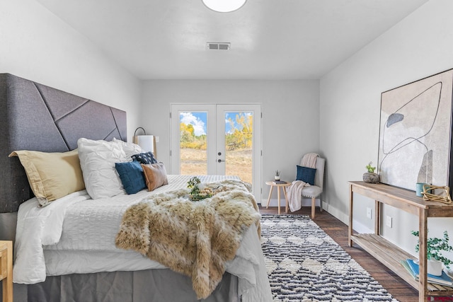 bedroom featuring french doors, hardwood / wood-style floors, and access to exterior