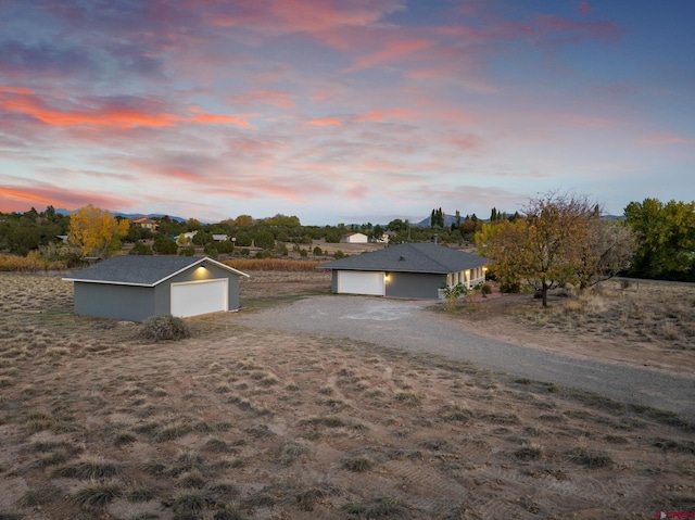 view of front of property featuring an outbuilding and a garage