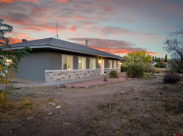 view of property exterior at dusk