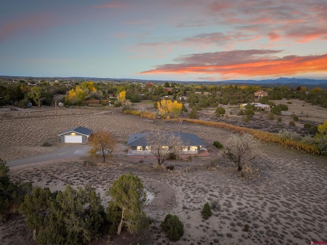 aerial view at dusk with a water view