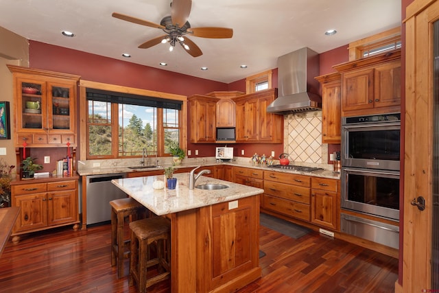 2239 Mockingbird Valley Ct, Durango, CO 81301 - kitchen featuring wall chimney range hood, stainless steel appliances, a sink, a warming drawer, and recessed lighting