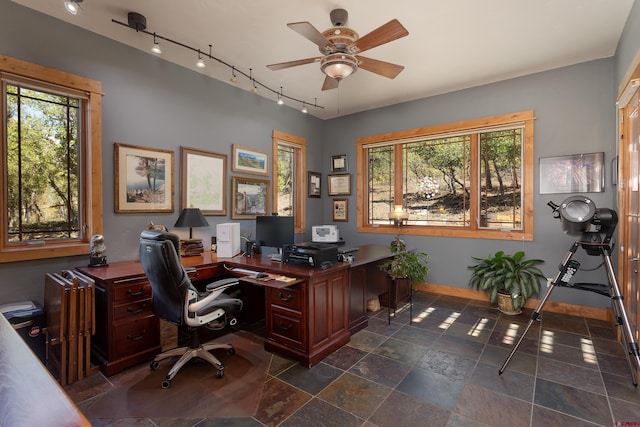 2239 Mockingbird Valley Ct, Durango, CO 81301 - office area featuring track lighting, a ceiling fan, healthy amount of natural light, and baseboards