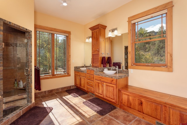 2239 Mockingbird Valley Ct, Durango, CO 81301 - full bathroom with double vanity, a stall shower, and tile patterned floors