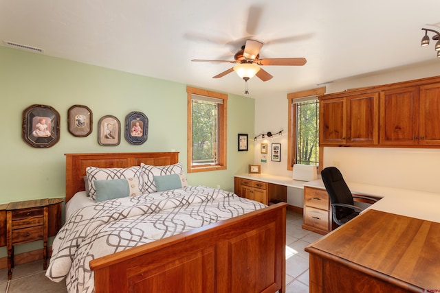 2239 Mockingbird Valley Ct, Durango, CO 81301 - bedroom with multiple windows, light tile patterned flooring, and a ceiling fan