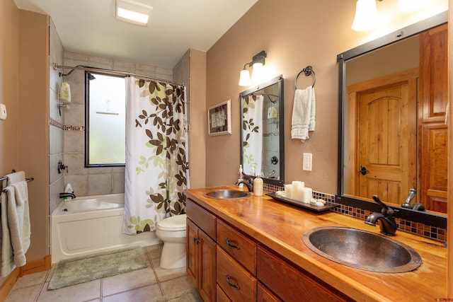 2239 Mockingbird Valley Ct, Durango, CO 81301 - bathroom featuring tile patterned floors, shower / bath combo, toilet, and double vanity
