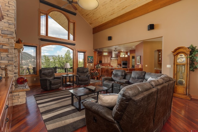 2239 Mockingbird Valley Ct, Durango, CO 81301 - living area featuring high vaulted ceiling, dark wood-style flooring, a ceiling fan, and wood ceiling with exposed beams