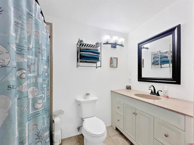 bathroom featuring a textured ceiling, toilet, tile patterned floors, walk in shower, and vanity