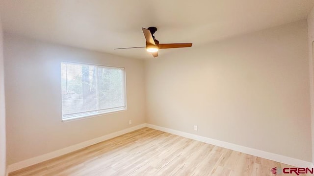 empty room featuring light hardwood / wood-style flooring and ceiling fan