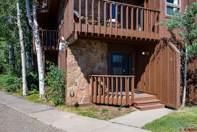 property entrance with a balcony