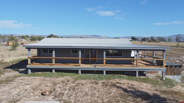 back of house featuring a mountain view