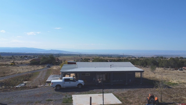 exterior space with a mountain view and a carport