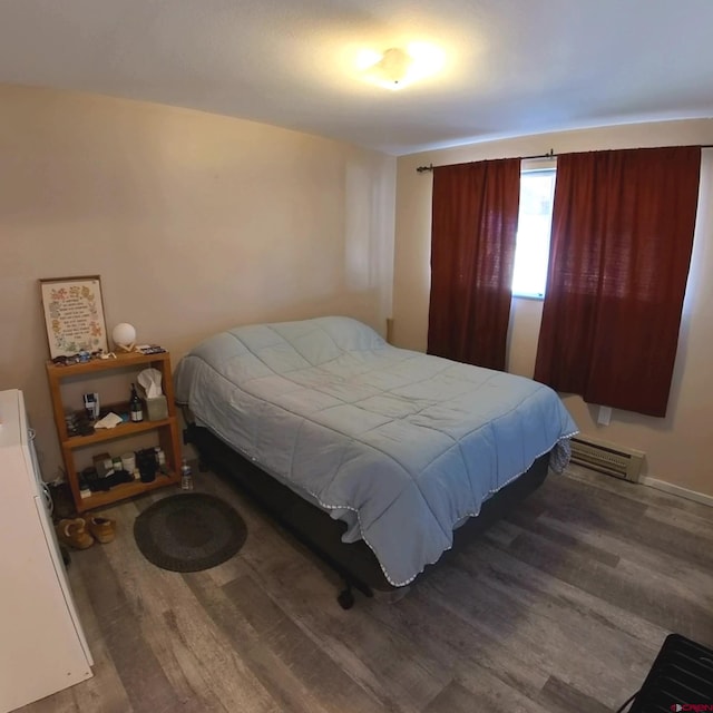 bedroom featuring dark hardwood / wood-style floors