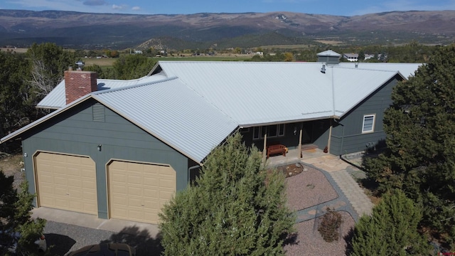 drone / aerial view featuring a mountain view