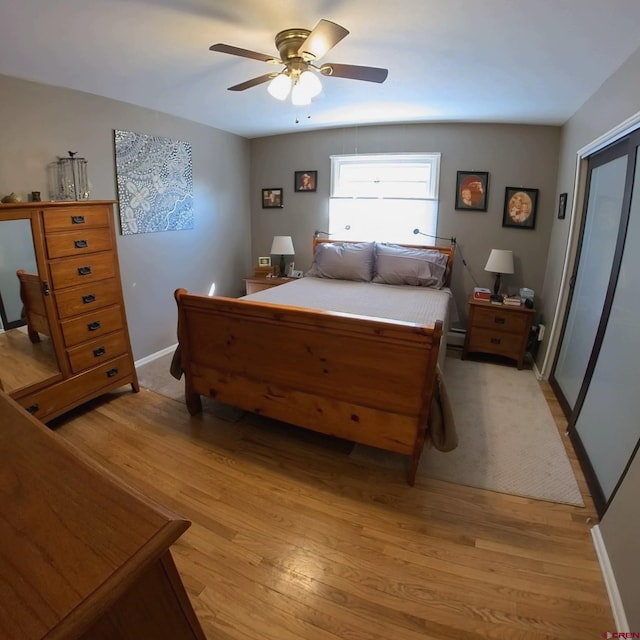 bedroom featuring ceiling fan and light wood-type flooring