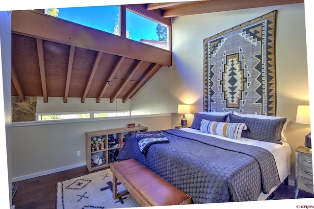 bedroom featuring vaulted ceiling with beams and hardwood / wood-style floors