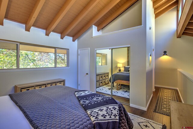 33 Davis Cup Unit 4008, Pagosa Springs, CO 81147 - bedroom with wood finished floors, wood ceiling with exposed beams, high vaulted ceiling, and baseboards