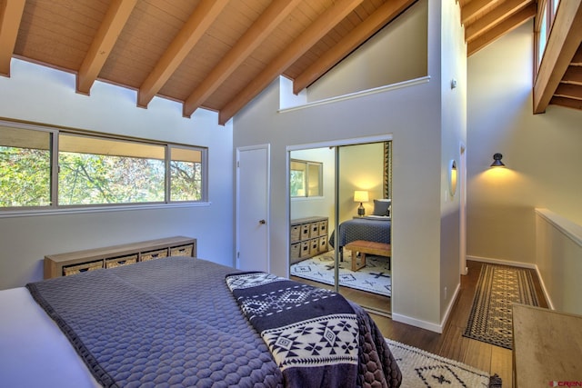 bedroom featuring dark wood-type flooring, beam ceiling, high vaulted ceiling, and wood ceiling